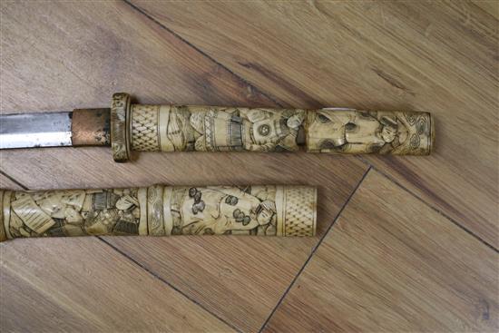 A Japanese carved bone katana short sword length 82cm